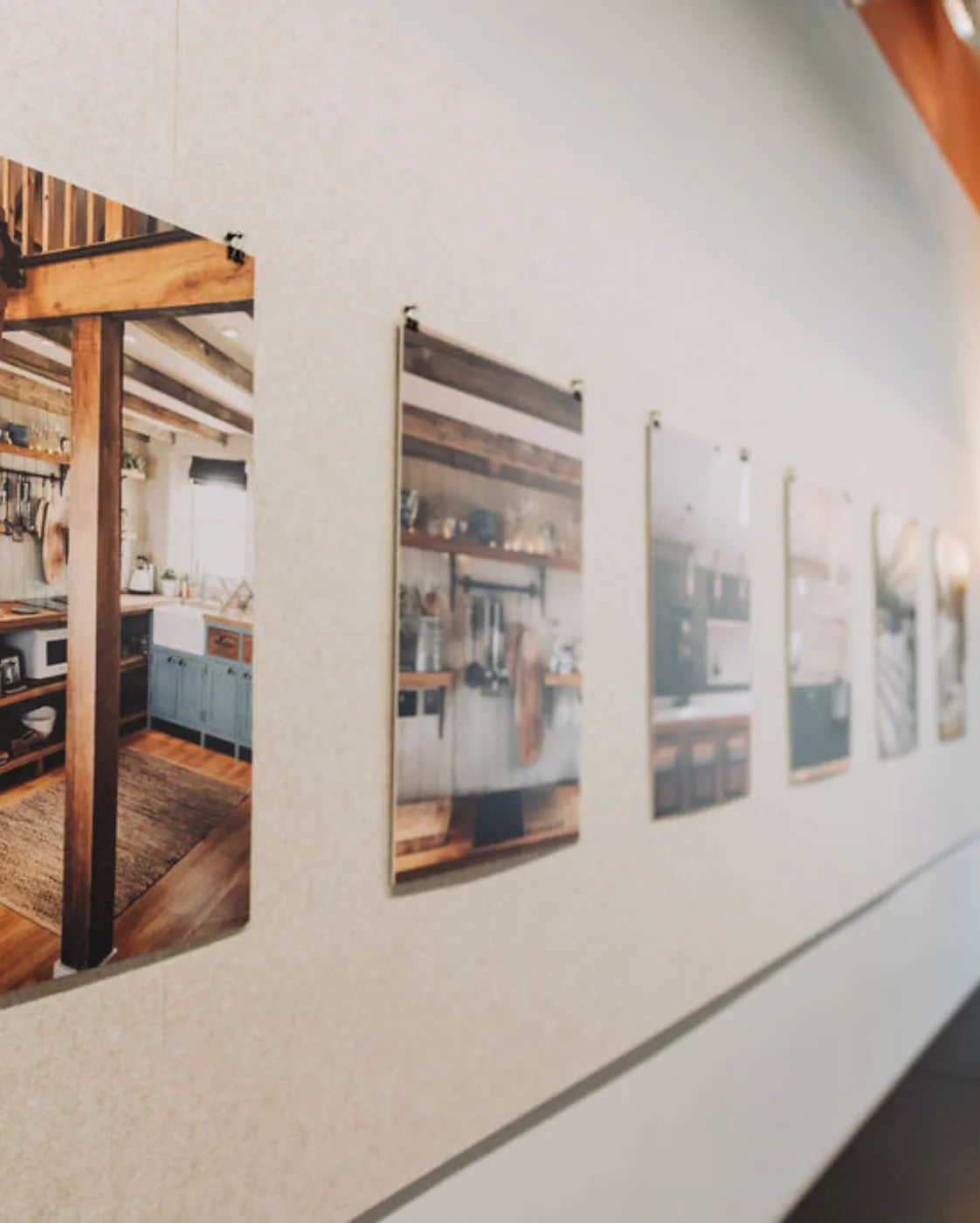 Set of framed interior design photos on a wall