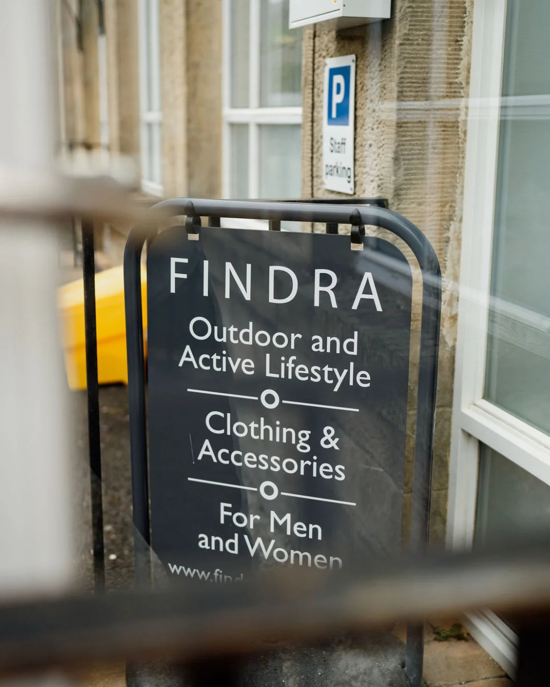 Findra outdoor and active lifestyle clothing and accessories sign outside a building.